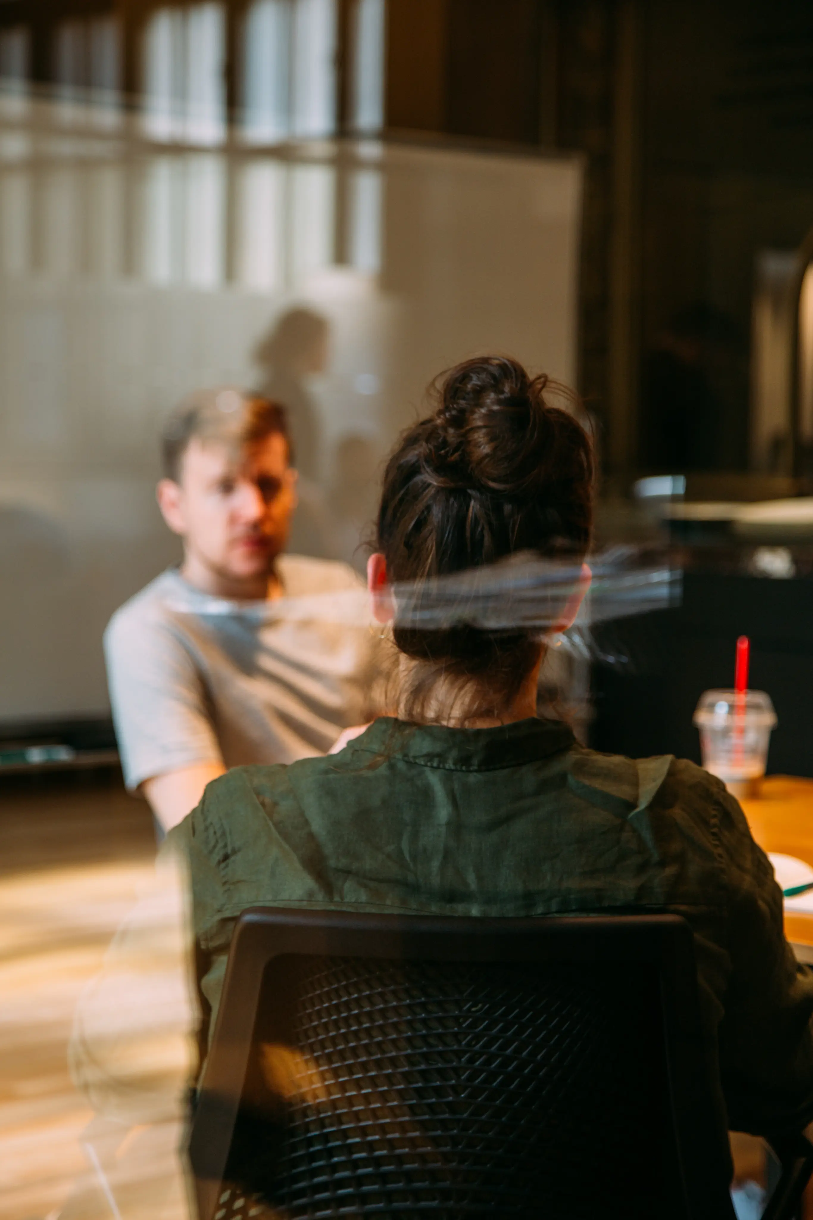 Man and woman talking during meeting